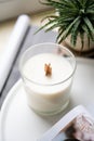 Natural new soy wax candle with wooden wick in clear glass jar Royalty Free Stock Photo