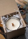 Natural new soy wax candle with wooden wick in clear glass jar Royalty Free Stock Photo