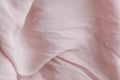 Natural nude gentle pink, light pastel textile cloth background, crumpled wavy texture