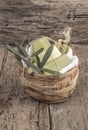 Natural olive oil soap bars and olive oil bottle in a basket Royalty Free Stock Photo