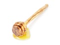 Natural olive wood dipper with honey isolated