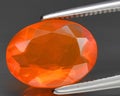 natural orange fire opal gem on the background Royalty Free Stock Photo
