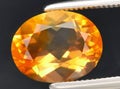 natural orange fire opal gem on the background Royalty Free Stock Photo