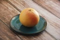 Natural orange fruit greupfruit on a plate Royalty Free Stock Photo