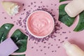 Natural organic cosmetics: body cream, bath salt, lavender and peach soap, shower gel, seashell with monstera leaves on a pink Royalty Free Stock Photo