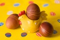 Natural organic Ester eggs with hen decoration and yellow background. Preparations for Easter. Royalty Free Stock Photo