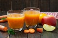 Natural organic fresh juice made of carrots and apples Royalty Free Stock Photo