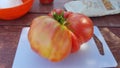 Natural organic and organic tomato just picked from the garden. Table prepared to make a good salad. Royalty Free Stock Photo