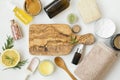 Natural organic skincare products with bath salt, oil, balm, lemon, honey for skin treatments, wooden board copy space Royalty Free Stock Photo