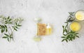 Natural organic skincare products on concrete background, top view, green natural skincare and beauty with  flowers, natural soap, Royalty Free Stock Photo