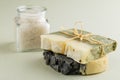 Natural organic soap with bath salt on green background Royalty Free Stock Photo