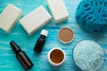 Natural organic soap bottles essential oil and sea salt herbal bath on a blue wooden table Royalty Free Stock Photo