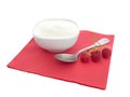 Natural organic yoghurt, yoghourt on red napkin with raspberries