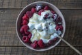 Natural organic yogurt with fresh red raspberries and cottage cheese for breakfast, top view, close up Royalty Free Stock Photo