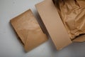 Natural paper package, carton on white background. Eco-friendly, no plastic product parcel wrapping. Care for environment,