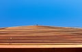 Natural wooden patterned construction on blue background Royalty Free Stock Photo