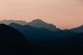 Natural patterns: layers of mountains in a foggy soft light at sunset. Garda Lake, Italy. Artistic, almost abstract Royalty Free Stock Photo