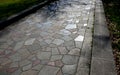 Natural paving of gneiss and granite irregular stones folded into a beautiful pattern where larger stones are surrounded by smalle