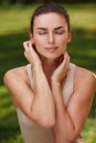 Natural peaceful portrait of a beautiful girl with pure skin relax outdoors Royalty Free Stock Photo