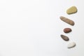 Natural pebble stones on white background