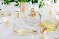 Natural perfume concept. Bottles of perfume with white flowers. Floral fragrance