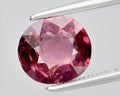 natural pink red rhodolite gem on the background Royalty Free Stock Photo