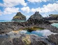 Natural Pool at Baia dos Porcos Beach and Morro Dois Irmaos - Fernando de Noronha, Pernambuco, Brazil Royalty Free Stock Photo