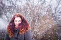 Natural portarit of young woman in snowy weather