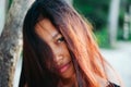 Natural portrait of beautiful young Asian girl smiling. girl with messy hair Royalty Free Stock Photo