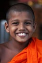 Natural portrait of a smiling child monk
