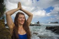 Natural portrait of young attractive and happy red hair woman practicing meditation and relaxation yoga lotus exercise sitting at Royalty Free Stock Photo