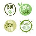 Natural products logo stickers. Organic fresh food labels with text and leaves. Eco and bio circle hand drawn packaging Royalty Free Stock Photo