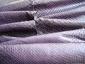 Natural python skin texture. Purple haberdashery snake skin. Royalty Free Stock Photo