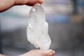 Natural quartz crystal stone in hand Royalty Free Stock Photo