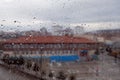 Natural rain droplets and outside landscape view on the glass