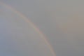 Natural rainbow in the gray overcast sky