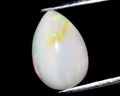 natural rainbow multi color opal gem on the background Royalty Free Stock Photo
