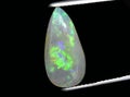 natural rainbow multi color opal gem on the background