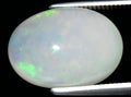 natural rainbow multi color opal gem on the background