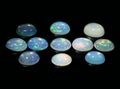 natural rainbow multi color opal gem on the background
