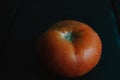 Natural real tomato isolated on black background