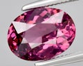 natural red rhodolite garnet gem on the background