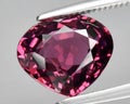 natural red rhodolite garnet gem on the background