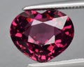 natural red rhodolite garnet gem on the background