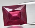 natural red rhodolite garnet gem on the background