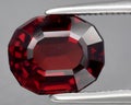 natural red rhodolite garnet gem on the background