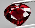 natural red rhodolite garnet gem on the background