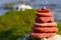 Pyramid of natural sea stones on the seashore. Royalty Free Stock Photo