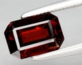 natural red spessartite garnet gem on the background Royalty Free Stock Photo