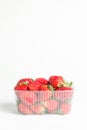 Natural red strawberries in a plastic transparent container Royalty Free Stock Photo